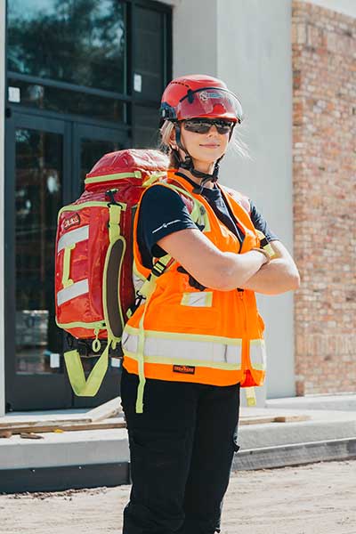 First aid medic on a construction site with jump bag