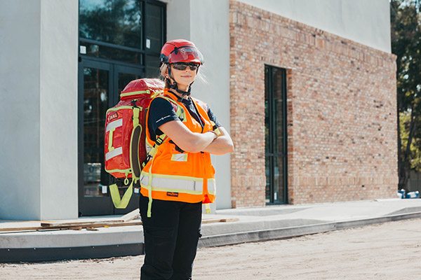 First aid medic on a construction site with jump bag