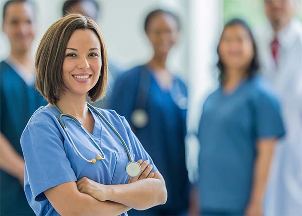 Nurse standing among peers